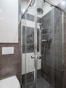 Kúpeľňa v ubytovaní P&O Apartments Wola Tarasy + 30 fotografií