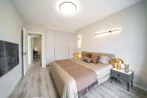 Postel nebo postele na pokoji v ubytování 上海柠檬汁民宿 Shanghai lemon juic B&B -Shanghai Lemon Deluxe Room外滩南京东路步行街