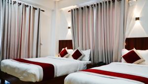 Postel nebo postele na pokoji v ubytování Hotel Sandalwood