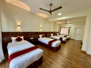 Postel nebo postele na pokoji v ubytování Hotel Sandalwood
