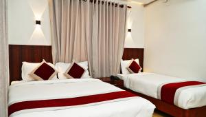 Postel nebo postele na pokoji v ubytování Hotel Sandalwood