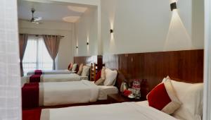 Postel nebo postele na pokoji v ubytování Hotel Sandalwood