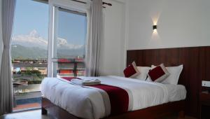 Postel nebo postele na pokoji v ubytování Hotel Sandalwood