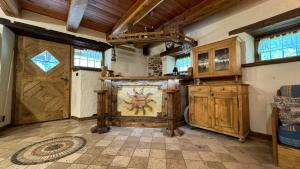a large room with a large wooden door with a painting on it at Il Cuore di Sopalù in Candide