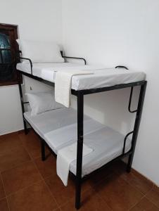 Postel nebo postele na pokoji v ubytování S and P Airport transit hostel and villa 01