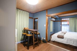 Postel nebo postele na pokoji v ubytování Mitomi inn