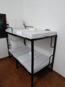Postel nebo postele na pokoji v ubytování S and P Airport transit hostel and villa 01