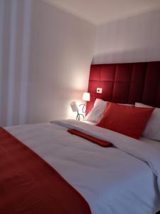 Ένα ή περισσότερα κρεβάτια σε δωμάτιο στο Apartman Orijent