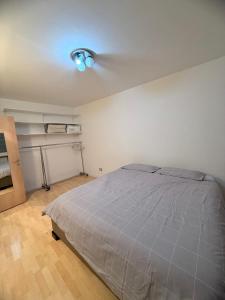 a bedroom with a bed and a ceiling fan at Vista Rosengarten in Bolzano