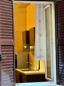 a kitchen with a sink and a window at Domus Gaia in Rome +37 photos