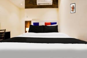 Postel nebo postele na pokoji v ubytování Hotel Orange Residency