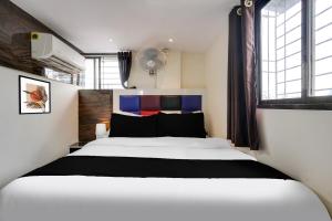 Postel nebo postele na pokoji v ubytování Hotel Orange Residency + 27 fotografií