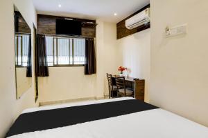 Postel nebo postele na pokoji v ubytování Hotel Orange Residency