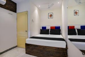 Postel nebo postele na pokoji v ubytování Hotel Orange Residency
