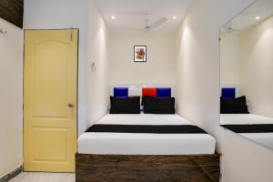 Postel nebo postele na pokoji v ubytování Hotel Orange Residency