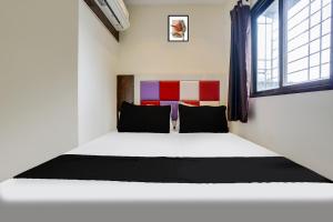 Postel nebo postele na pokoji v ubytování Hotel Orange Residency