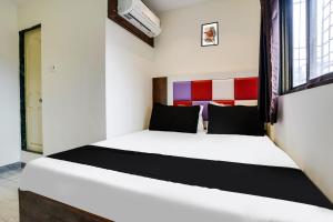 Postel nebo postele na pokoji v ubytování Hotel Orange Residency