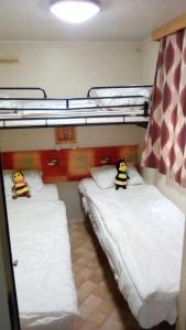 Un pat sau paturi într-o cameră la Camping Jackson