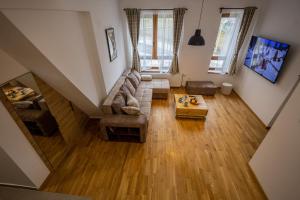 Μια τηλεόραση ή/και κέντρο ψυχαγωγίας στο Apartmani RAZVIGORA - DivčiNova
