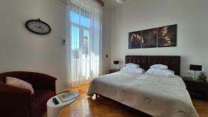 Postel nebo postele na pokoji v ubytování Rooms Tisa Old Town + 37 fotografií