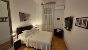 Postel nebo postele na pokoji v ubytování Rooms Tisa Old Town
