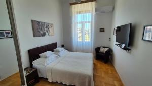 TV a/nebo společenská místnost v ubytování Rooms Tisa Old Town