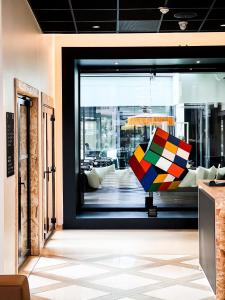 a room with a window with a colorful object in it at Le Néliö in Aix-en-Provence