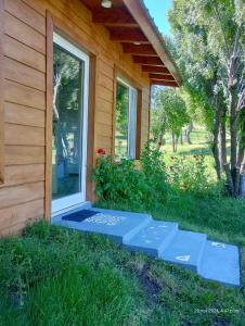 a porch of a house with a window at Prunus Casa de Montaña in El Hoyo +3 photos
