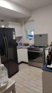 Kuchyň nebo kuchyňský kout v ubytování CHAME VIBES Apartamento PB en Playa Caracol Chame
