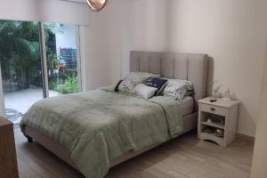Postel nebo postele na pokoji v ubytování CHAME VIBES Apartamento PB en Playa Caracol Chame + 29 fotografií