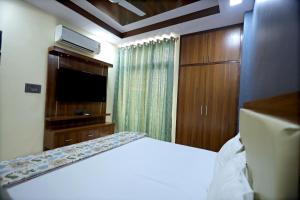 Krevet ili kreveti u jedinici u objektu Uptown Jaipur- Luxury Premium Apartment