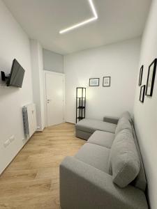 a living room with a couch and a television at La Casetta Dell'Artista in Pesaro +19 photos