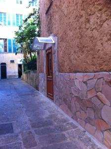 a stone building with a door on the side of it at Appartement centre ville in Ajaccio