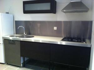 a kitchen with a sink and a stove at Appartement centre ville in Ajaccio