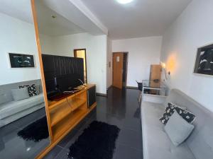 TV a/nebo společenská místnost v ubytování Flat Piemonte