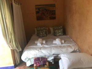 Postel nebo postele na pokoji v ubytování RIAD DES DEUX MERS