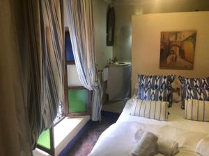 Postel nebo postele na pokoji v ubytování RIAD DES DEUX MERS