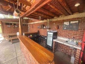 an outdoor kitchen with a counter and a sink at Quinta de Fagua in Sutatausa