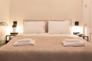 Ένα ή περισσότερα κρεβάτια σε δωμάτιο στο Design Flower Square Apartments