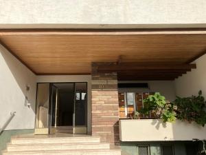 a wooden roof over a porch of a house at Studio Cosy Illkirch in Strasbourg