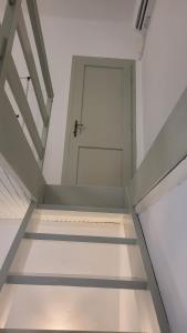 an empty room with a door and a stairway at Duplex apartment in the center of Jelsa, Hvar in Jelsa