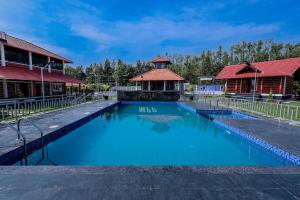 a swimming pool at a resort with a gazebo at Mountain Peak Resort in Hassan +19 photos