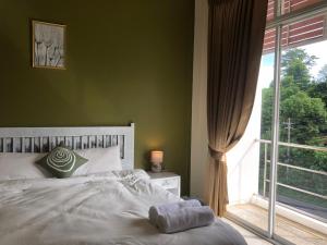 Postel nebo postele na pokoji v ubytování TIL DAWN Phuket