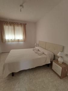 En eller flere senge i et værelse på Casa María