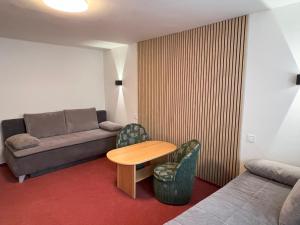 Posezení v ubytování Apartmán Branisko - Nový Smokovec + 32 fotografií