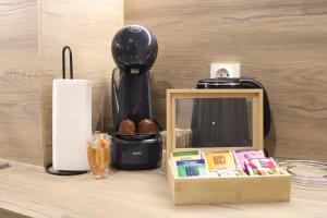 a coffee maker and a box on a table at Mountain studio ASP E63 Borovets Gardens in Borovets