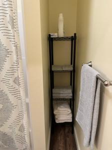 a bathroom with a towel rack with towels at N Walnut Street in Bloomington +10 photos