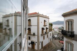 a view from the window of a building at La Galeria in Vigo