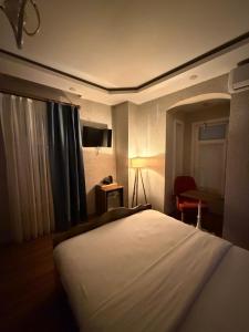 Postel nebo postele na pokoji v ubytování La Vien Hotel Old City