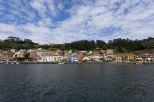 a town on the shore of a body of water at Sea Breeze and beautiful views! in Muros de Nalón